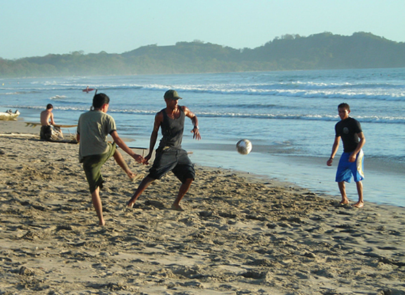 Dennis Playing Soccer on the Beach
