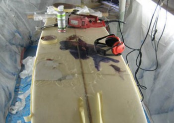mending surfboard