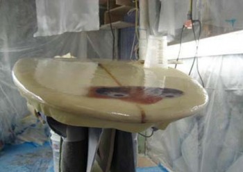 mending surfboard